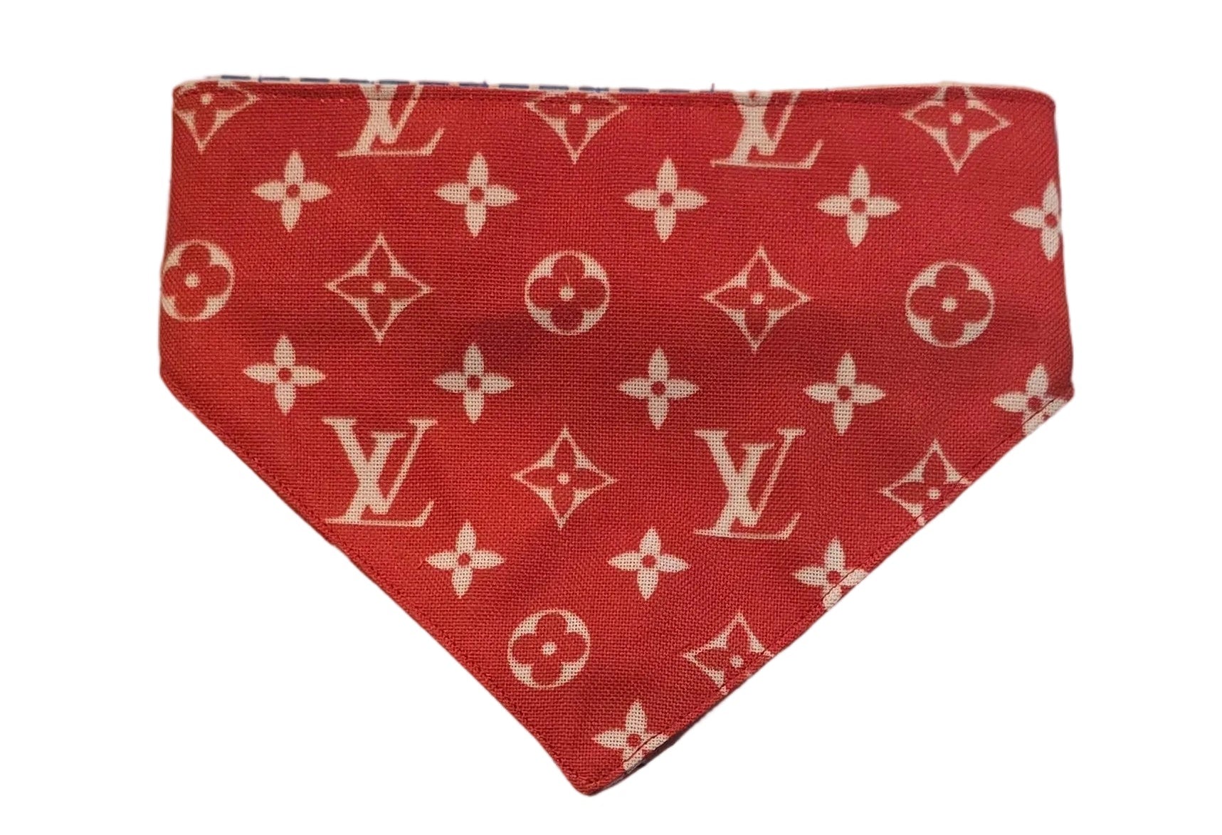 Red fabric pieces with a pattern on a grid background