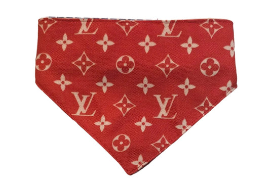 Red fabric pieces with a pattern on a grid background